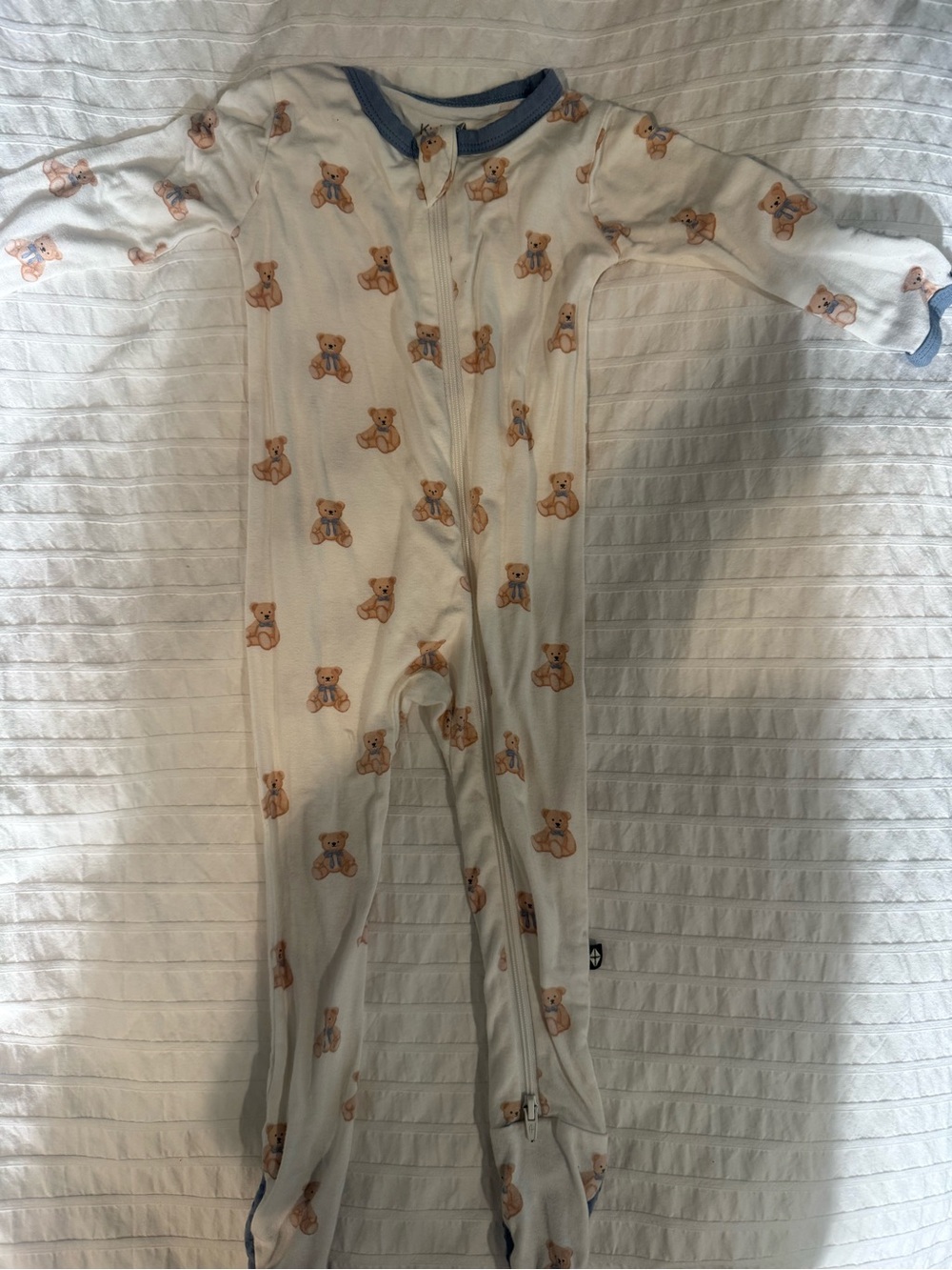Kyte BABY Cream Footed One-Piece with Tan Teddy Print and Blue Trim